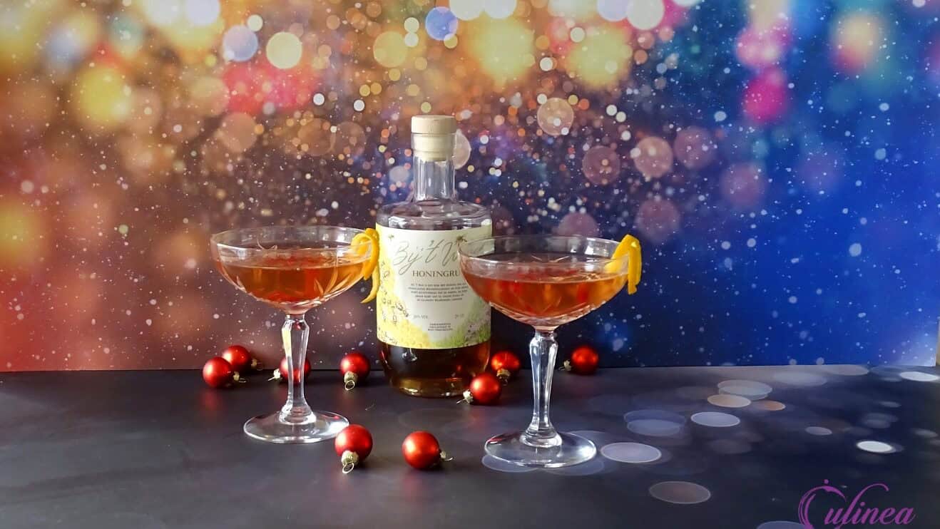 Cocktail met honingrum en granaatappel